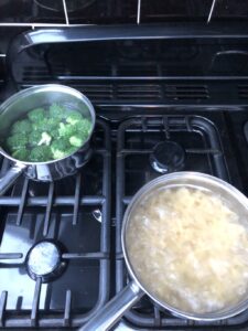 Boil pasta and broccoli